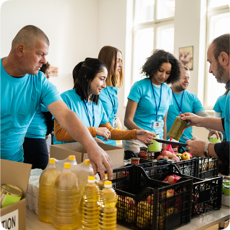 Volunteers organizing food donations in boxes.